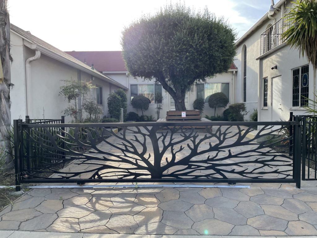 Church garden with decorative fence and tree
