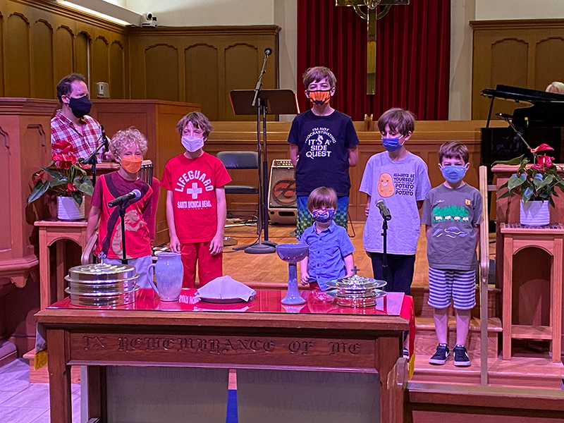 Kids behind Easter altar